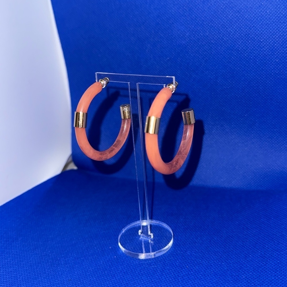 Acrylic hoop earrings with gold accents